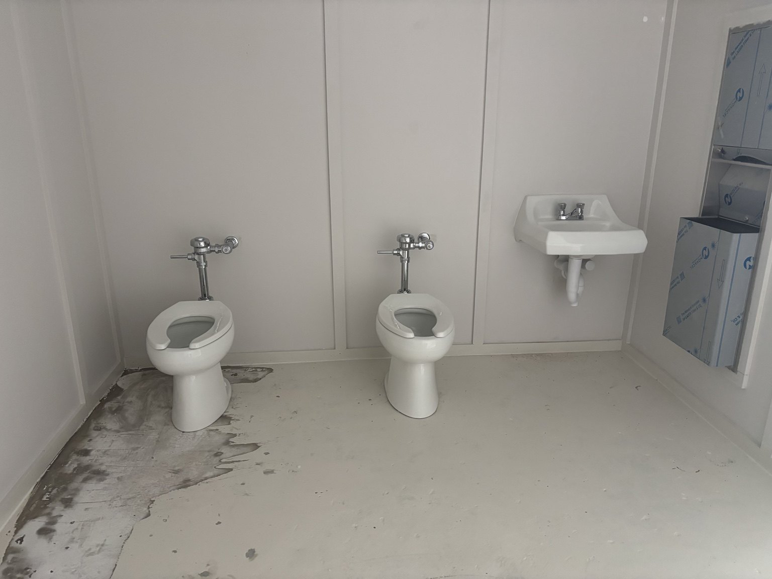 Commercial restroom fixture installation