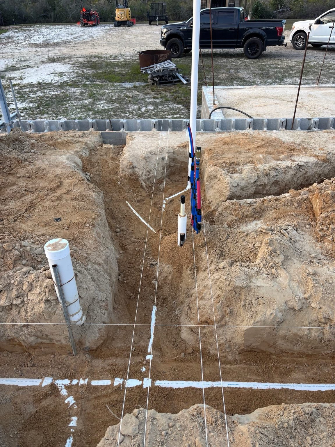 New construction plumbing trench and risers